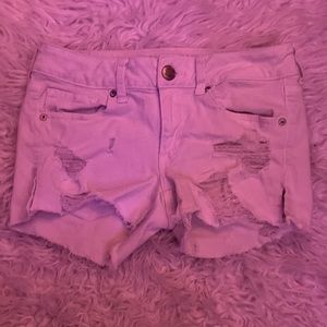 Super stretch booty shorts w/ rip detail on front by pocket. American Eagle/4
